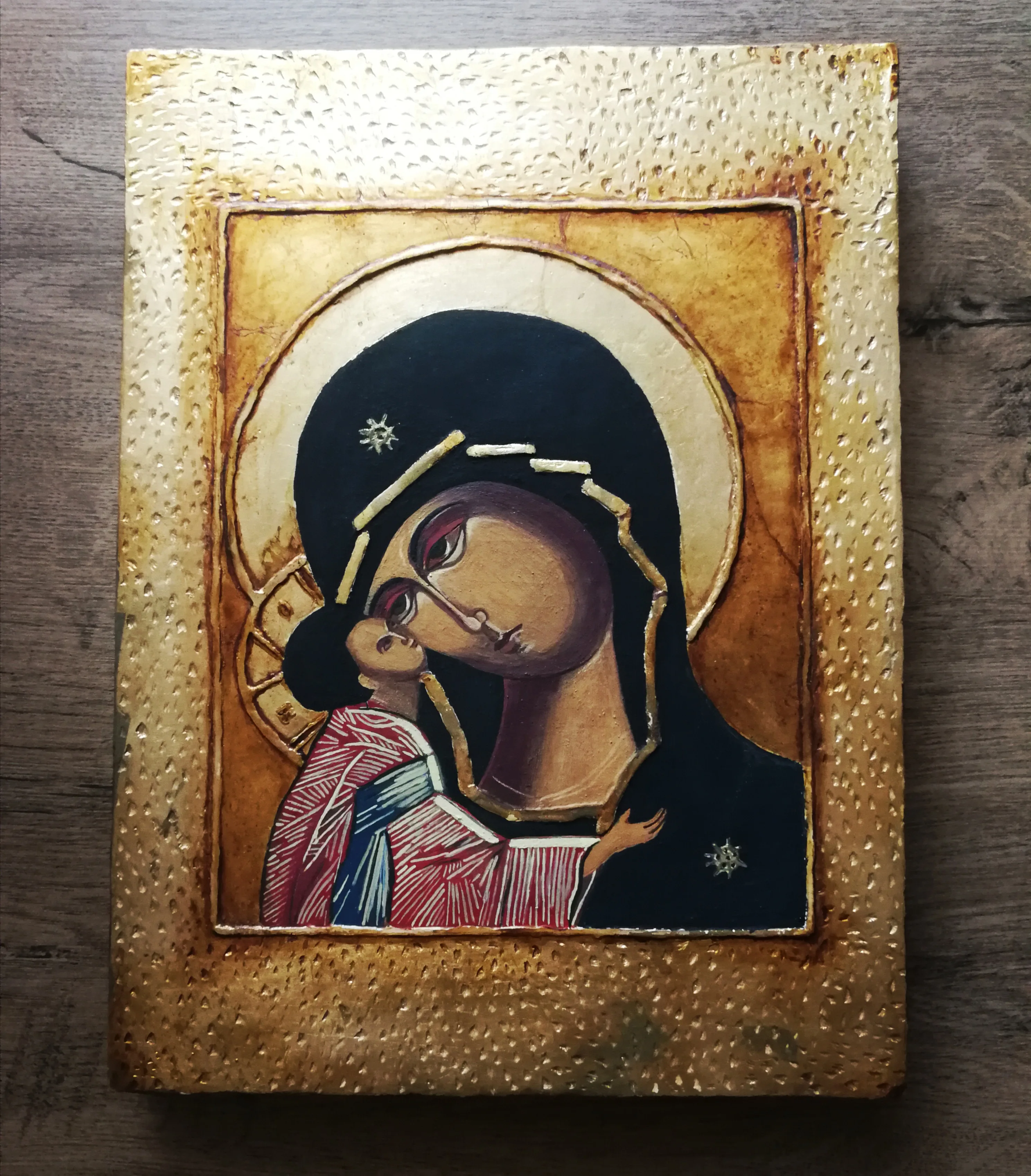 The icon of the Mother of God with the Child, measuring 33x25 cm, gilded and made with tempera on board