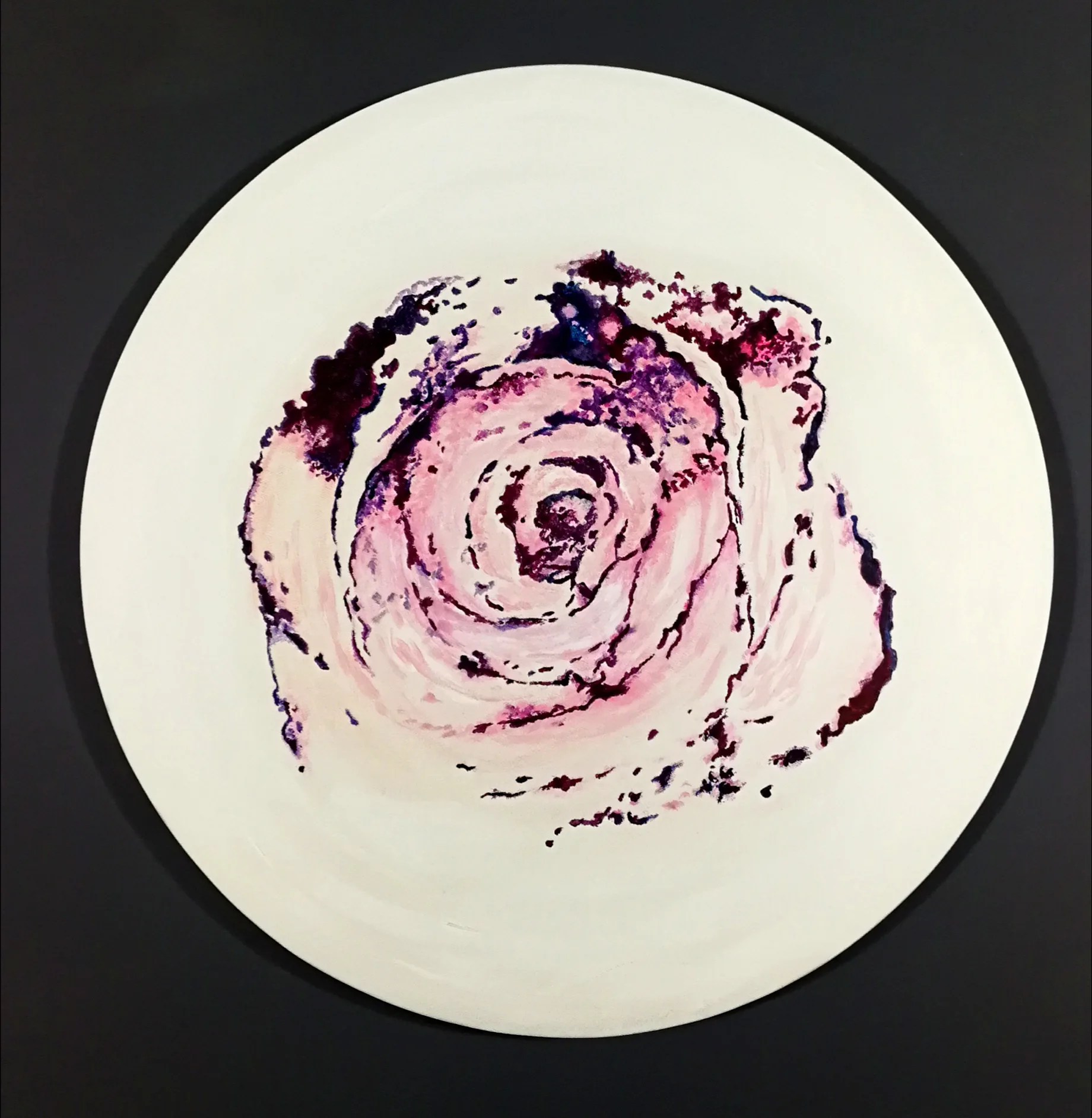 The tondo depicting a dark rose on a white background, with dimensions of 50 cm, made using acrylic on canvas technique